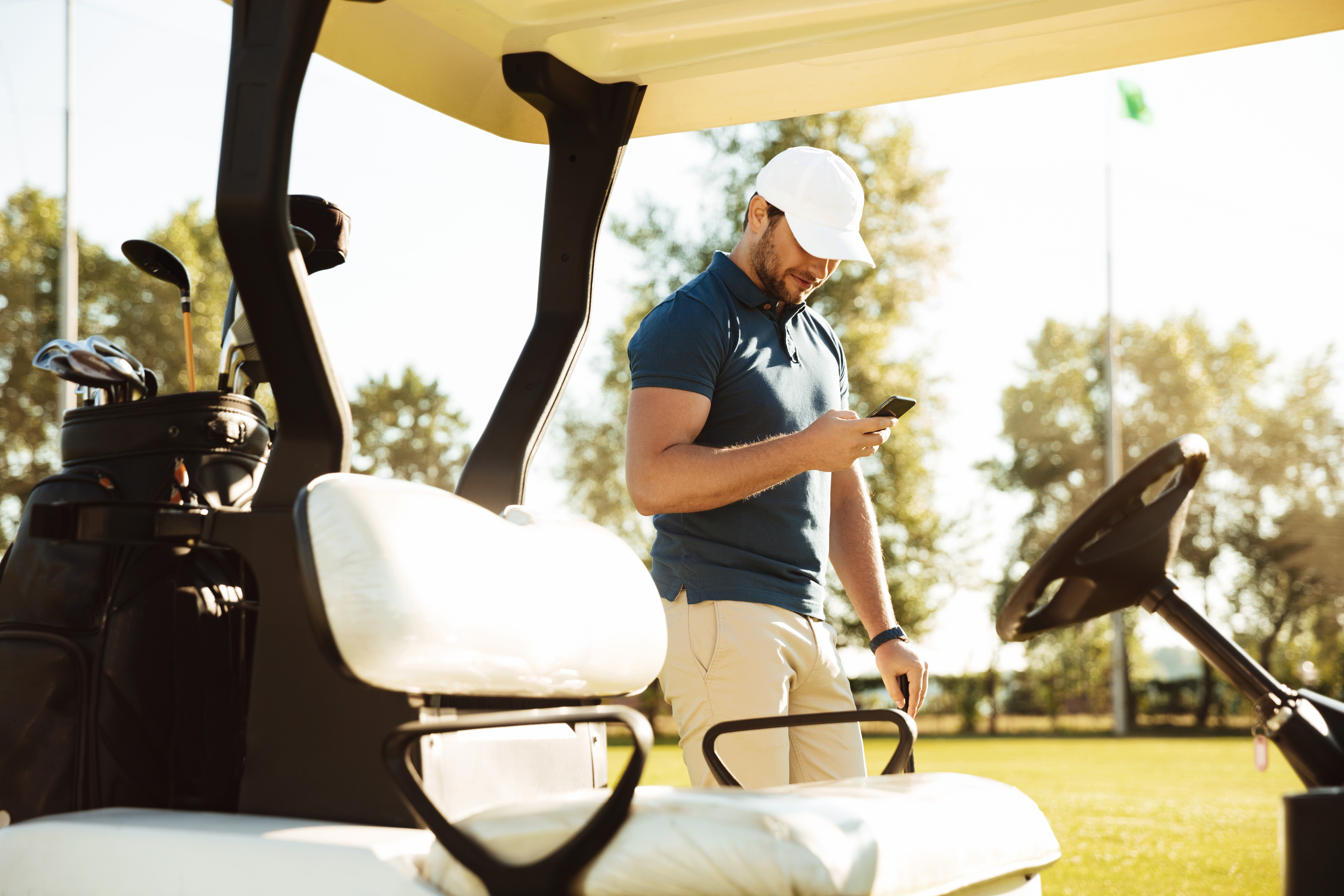 Golfer using mobile app on course
